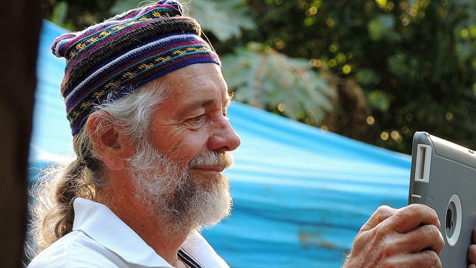 Old man with technology